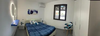 Letto o letti in una camera di Villa Ohana