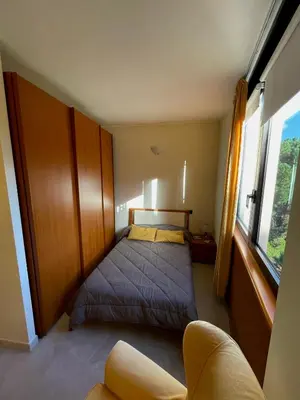 Letto o letti in una camera di Alloggio con parcheggio privato - Cagliari