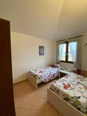 Letto o letti in una camera di Casa Rosa