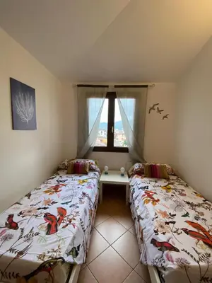 Letto o letti in una camera di Casa Rosa