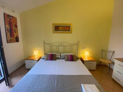 Letto o letti in una camera di Casa Rosa