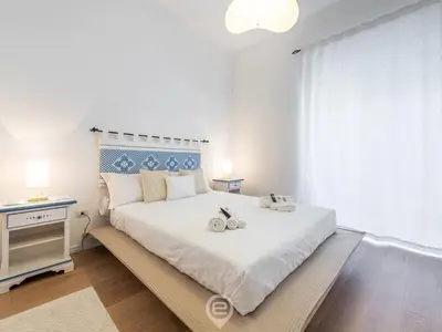 Letto o letti in una camera di La Finestra sul Corso