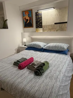 Letto o letti in una camera di Empathy Suite