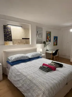 Letto o letti in una camera di Empathy Suite