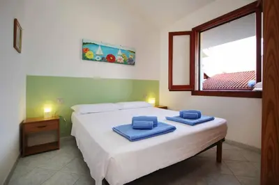 Letto o letti in una camera di Casa MaGi - Sa Murta Apartments