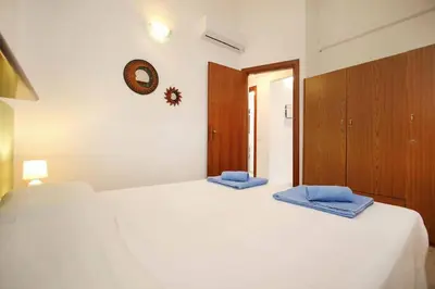 Letto o letti in una camera di Casa MaGi - Sa Murta Apartments