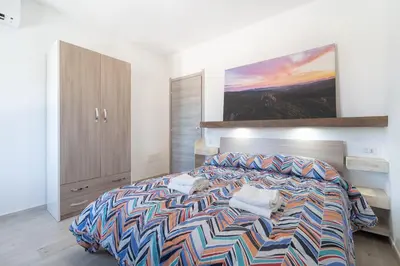 Letto o letti in una camera di Pantaleo Rooms