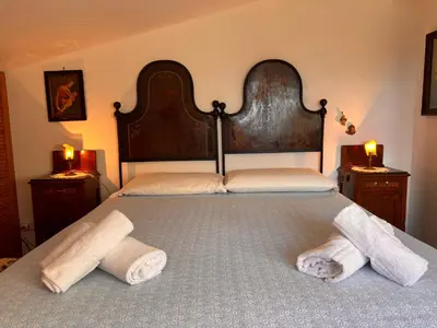Letto o letti in una camera di Villa Olga