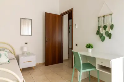 Letto o letti in una camera di Cagliari Center - Sonnino House