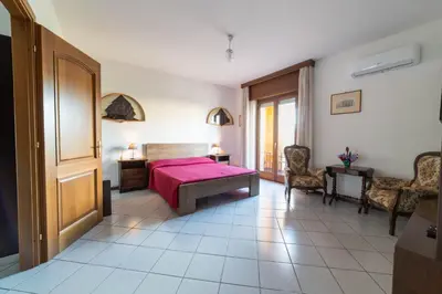 Letto o letti in una camera di Casa Wanda IL MIRTO