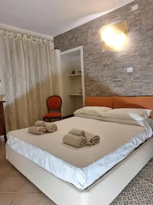 Letto o letti in una camera di Casa Cavallotti