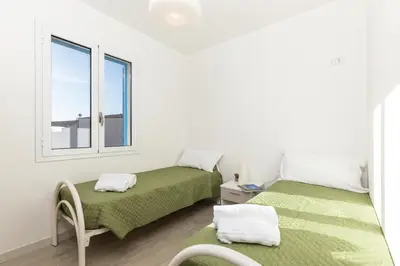 Letto o letti in una camera di Casa Bynos Supramonte vista mare A