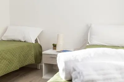 Letto o letti in una camera di Casa Bynos Supramonte vista mare A