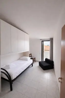 Letto o letti in una camera di Casa Stella Marina
