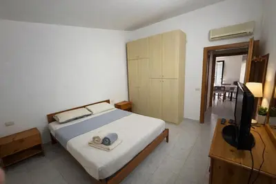 Letto o letti in una camera di Casa Stella Marina