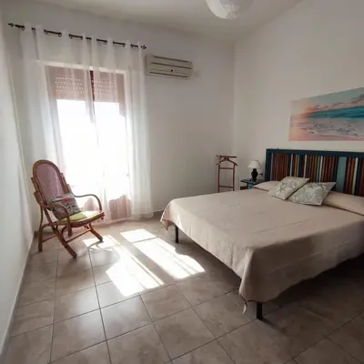Letto o letti in una camera di Casa Barù - Gonnesa