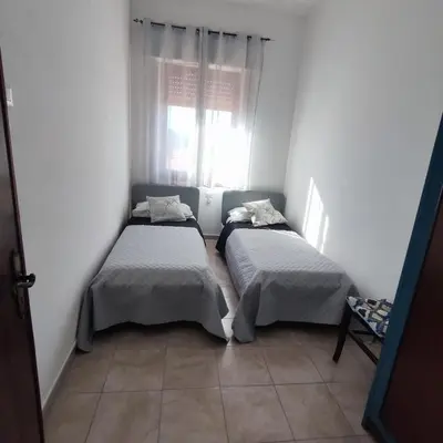 Letto o letti in una camera di Casa Barù - Gonnesa