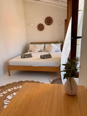 Letto o letti in una camera di Dòmo Anděl Sardinia