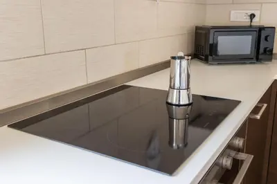 Cucina o angolo cottura di Attico Eleonora- Terrazza & parcheggio in centro