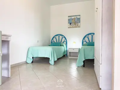 Letto o letti in una camera di Casa Chiara