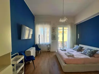 Letto o letti in una camera di Domus Avendrace