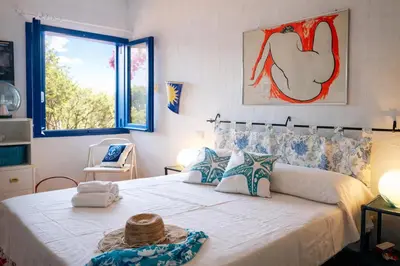 Letto o letti in una camera di Villa Il Gabbiano a few minutes walk from the sea