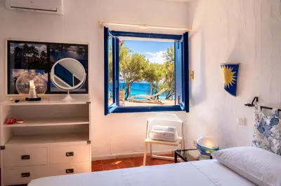Letto o letti in una camera di Villa Il Gabbiano a few minutes walk from the sea