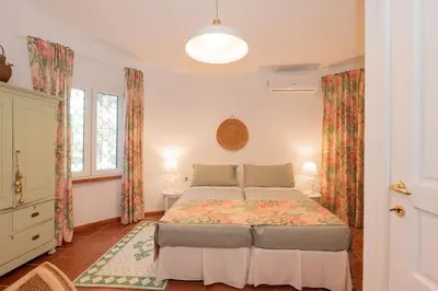 Letto o letti in una camera di Villa Gioia Tranquil Hideaway Beach Cottage