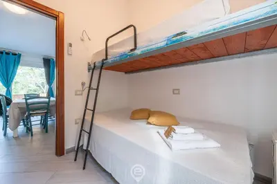 Letto o letti in una camera di Pinus Village Coastal Hideway
