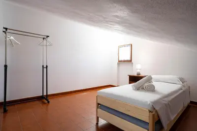 Letto o letti in una camera di Casa Terra Mia