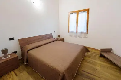 Letto o letti in una camera di Casa vacanze Sibilla appartamento Espero