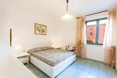 Letto o letti in una camera di Casa Vacanze Villa Flumini