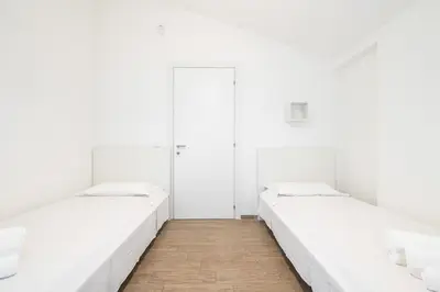 Letto o letti in una camera di Casa Dana, Wellness & Family Home SouthSardiniaHolidays