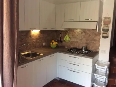 Cucina o angolo cottura di Holiday Home Gemütliches Ferienhaus mit Kamin in Porto Tramat by Interhome