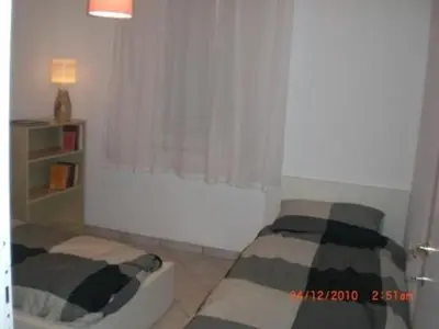 Area soggiorno di Apartment Wohnung in Soleminis mit Grill by Interhome