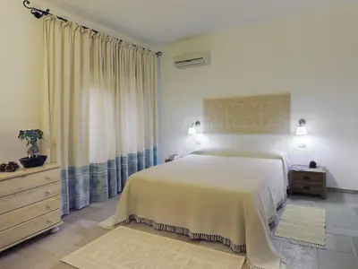 Letto o letti in una camera di Apartment Zwei-Zimmer-Wohnung in Santa Margherita di Pula by Interhome