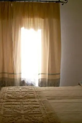 Letto o letti in una camera di Apartment Zwei-Zimmer-Wohnung in Santa Margherita di Pula by Interhome