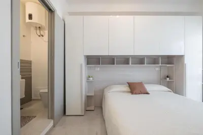 Letto o letti in una camera di L'ulivo di Villasimius