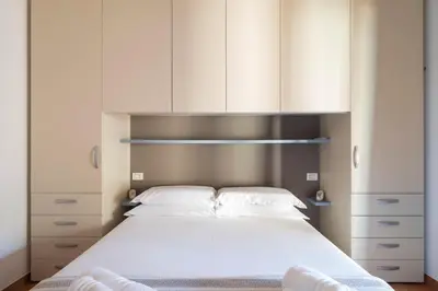 Letto o letti in una camera di Sa Marina Holiday House - al mare con giardino