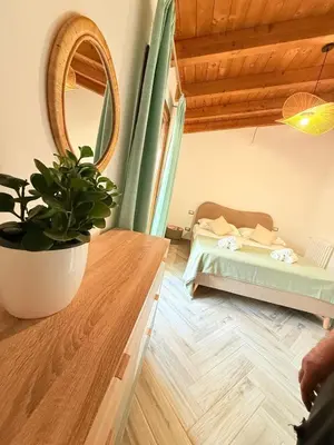 Letto o letti in una camera di Villa Eden
