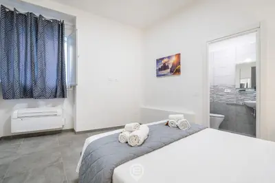 Letto o letti in una camera di Appartamento Antica Parruccheria