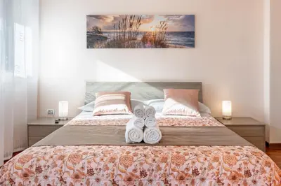 Letto o letti in una camera di GuestHost - Relax & Fun Home between sea & city