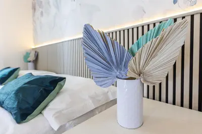 Letto o letti in una camera di GuestHost - Relax & Fun Home between sea & city
