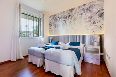 Letto o letti in una camera di GuestHost - Relax & Fun Home between sea & city