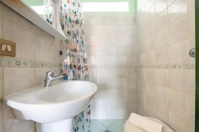 Bagno di Villetta Acquamarina, con giardino e patio vicino alla spiaggia di Le Saline