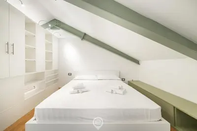 Letto o letti in una camera di Angioy 54 Loft, Cosy flat in central Cagliari