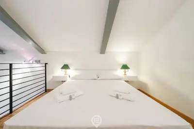 Letto o letti in una camera di Angioy 54 Loft, Cosy flat in central Cagliari