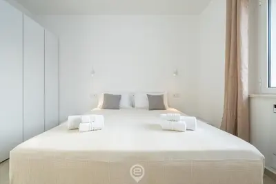 Letto o letti in una camera di Coru e Mari Appartamenti - Laguna