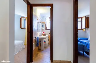 Letto o letti in una camera di Villa Minou