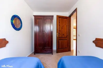 Letto o letti in una camera di Villa Minou